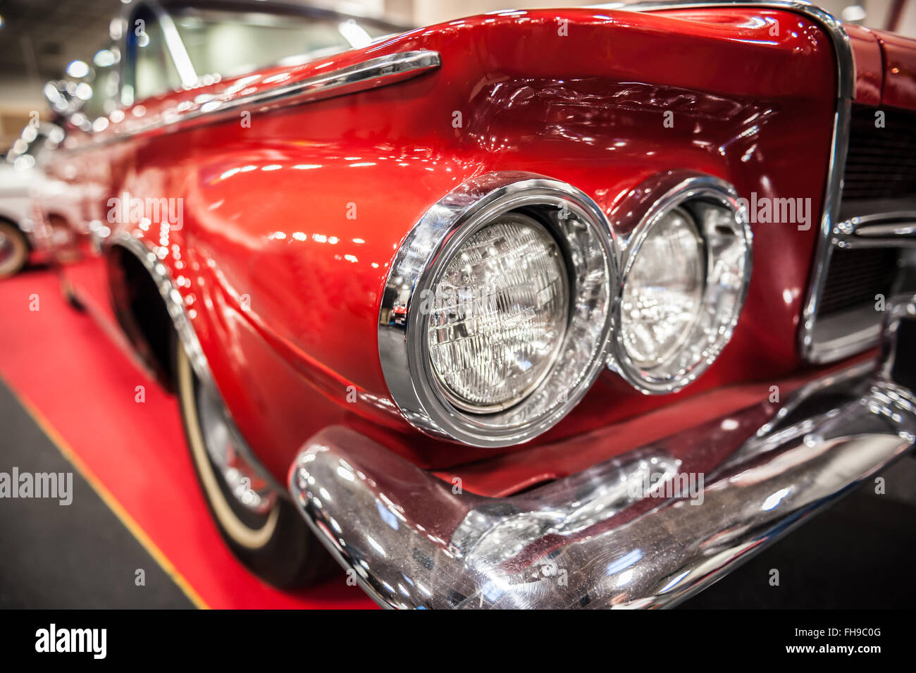 Headlights of a red vintage car in a salon Stock Photo