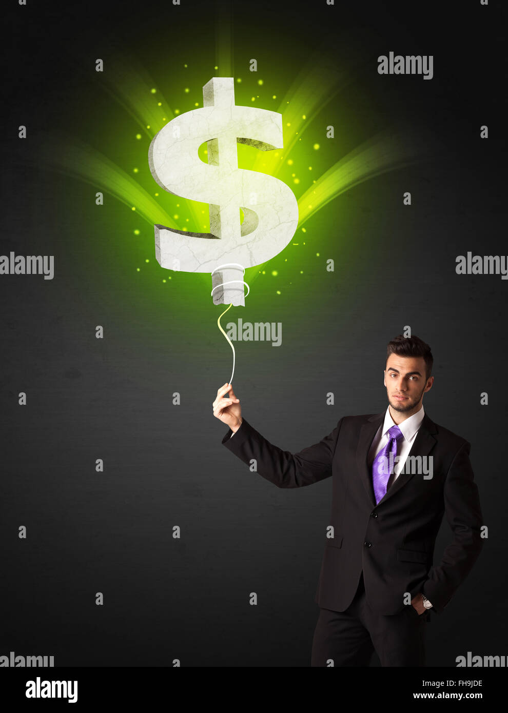 Businessman with a dollar sign balloon Stock Photo - Alamy