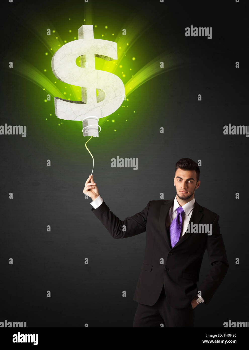 Businessman with a dollar sign balloon Stock Photo - Alamy