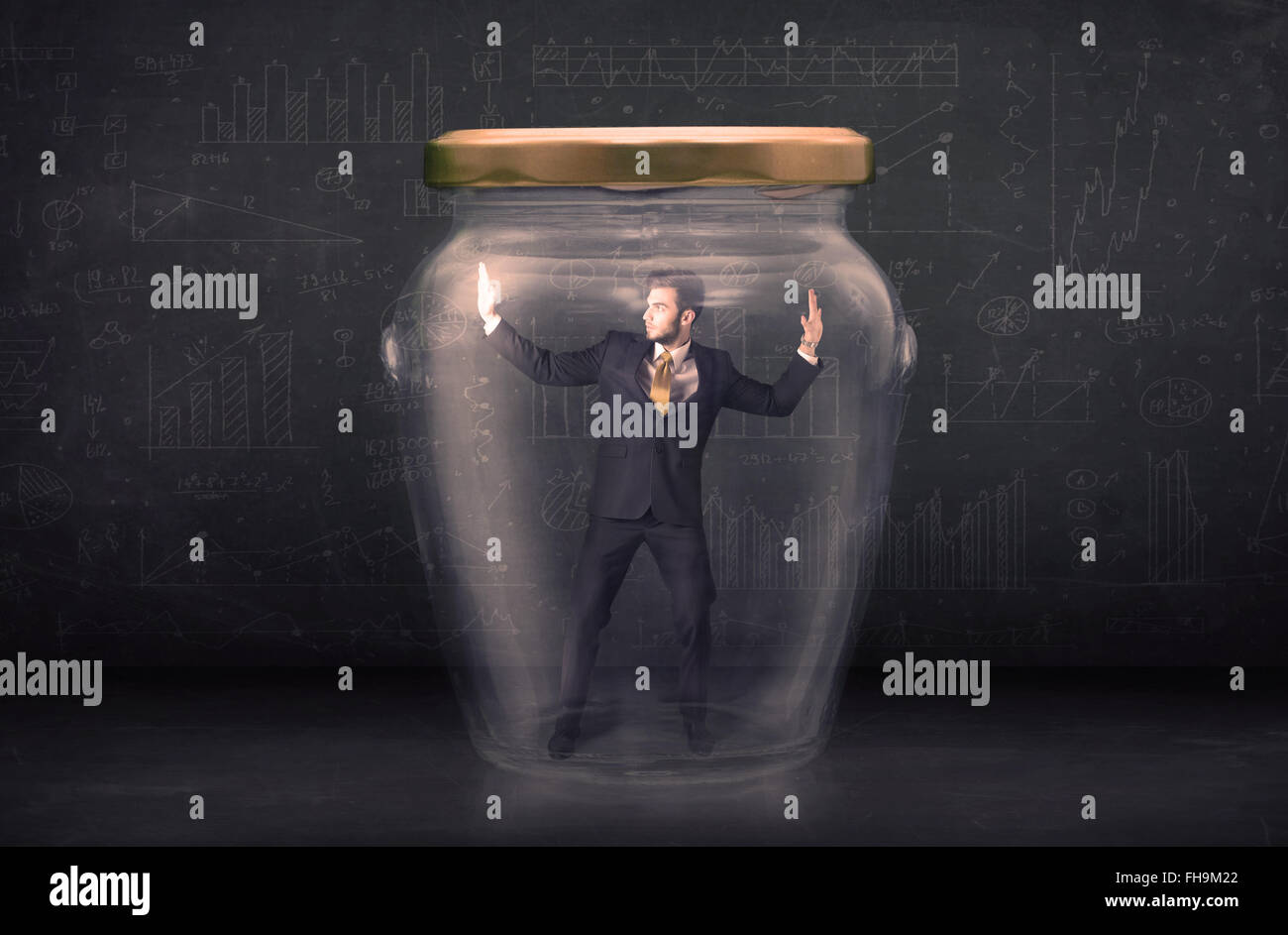 Business man closed into a glass jar concept Stock Photo - Alamy