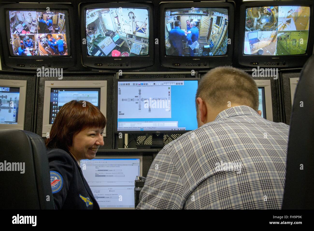 Star City, Russia. 24th February, 2016. International Space Station Expedition 47 prime crew members Jeff Williams, Russian cosmonaut Oleg Skripochka, and Russian cosmonaut Alexei Ovchinin are seen on the control room monitors during Soyuz qualification exams at the Gagarin Cosmonaut Training Center February 24, 2016 in Star City, Russia. Stock Photo