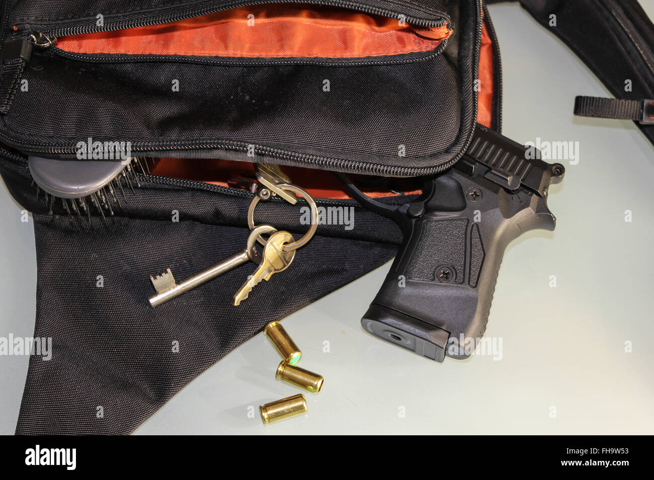 Carried concealed. Handgun and accessories falling from a woman's purse