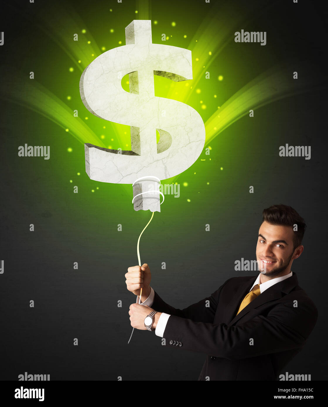 Businessman with a dollar sign balloon Stock Photo - Alamy