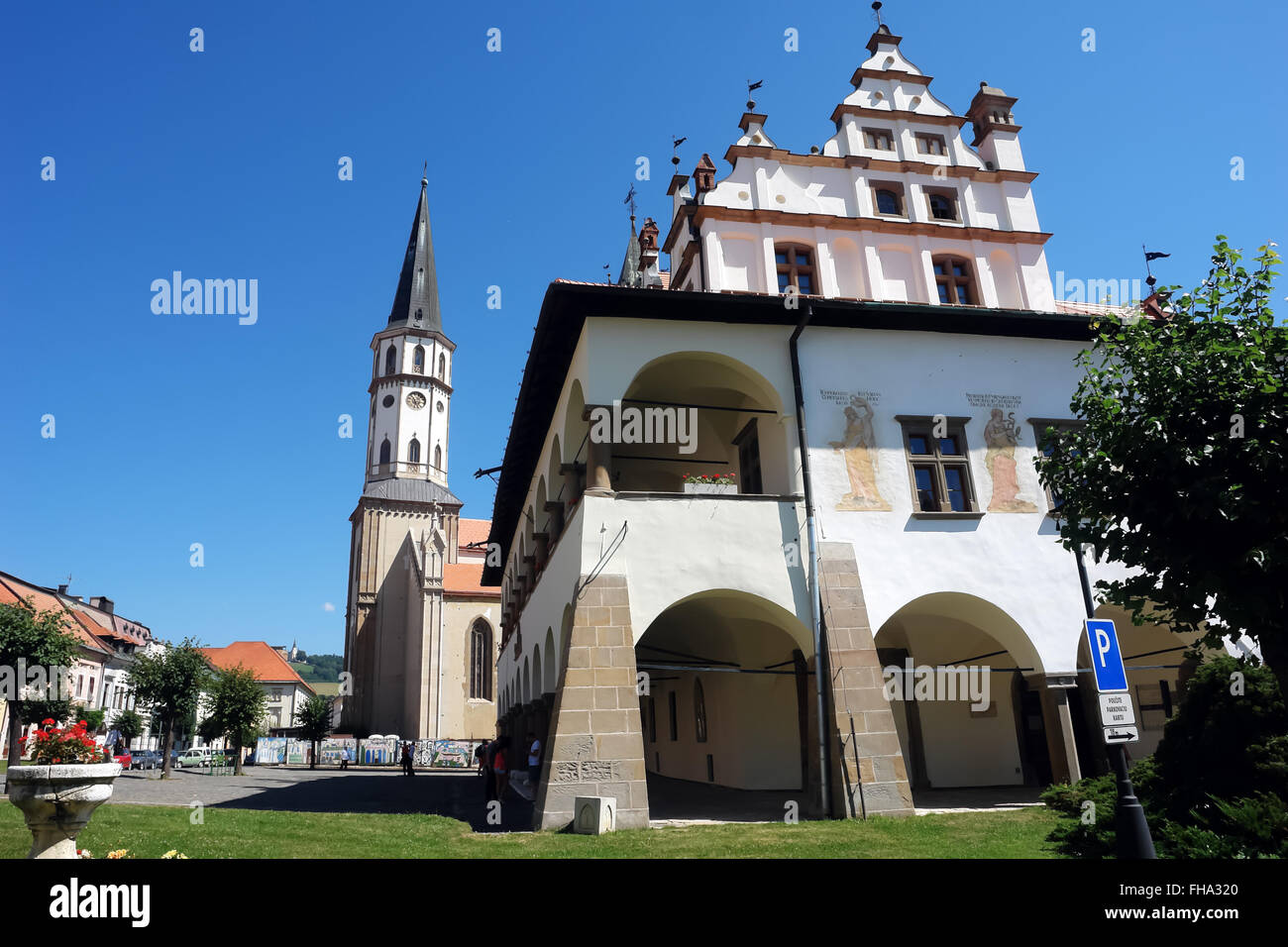 Levoca, PRESOV, SLOVAKIA - AUGUST 06, 2013: Old historic building and church on the central square in Levoca, Slovakia. Stock Photo