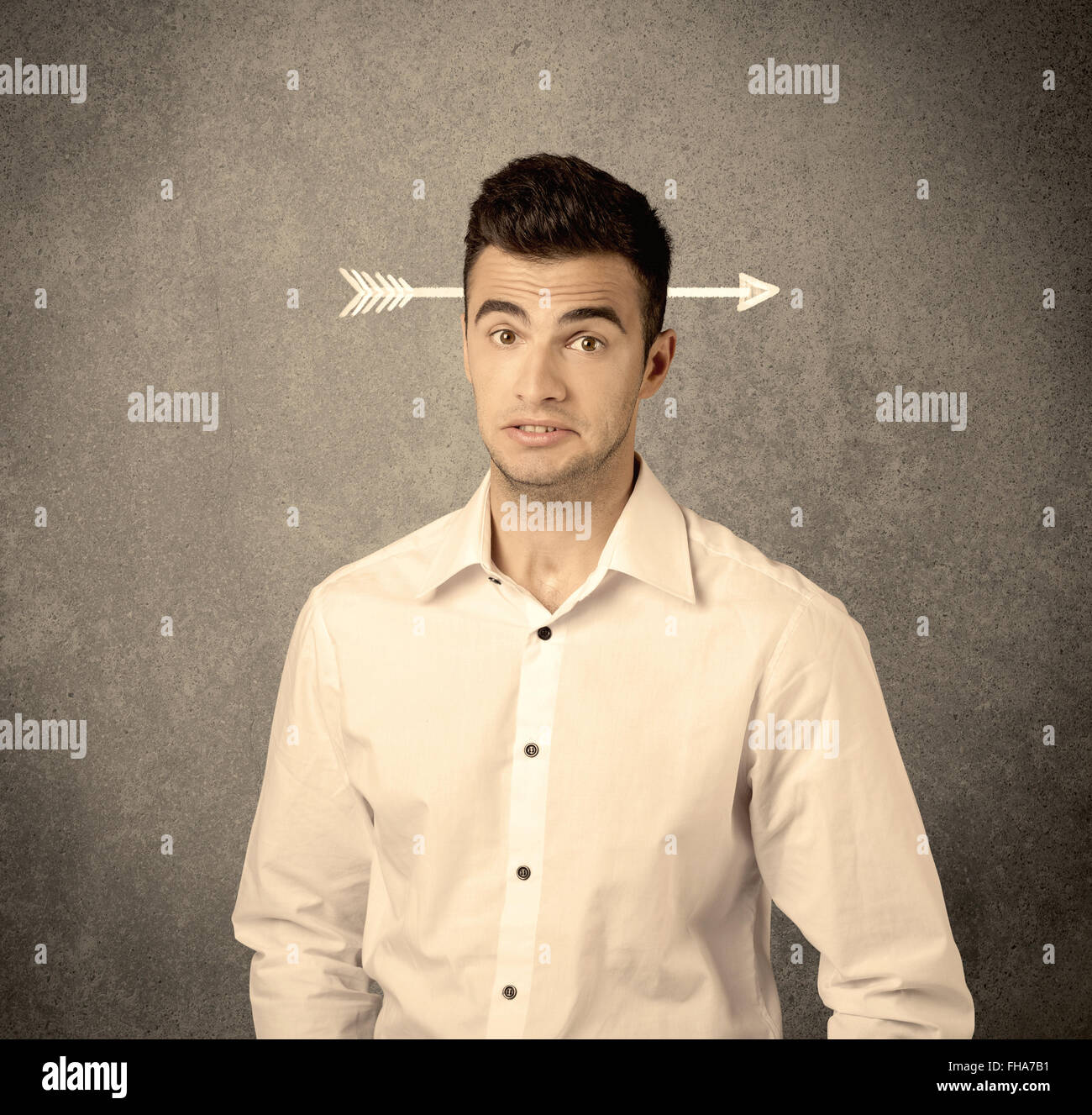 Young sales guy with arrow in the head Stock Photo - Alamy