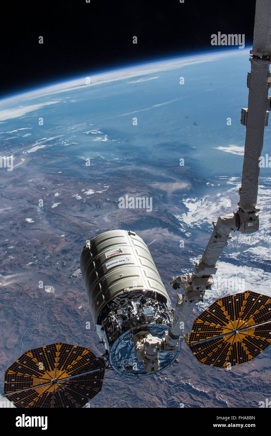 The International Space Station's Canadarm 2 releases the Orbital Sciences Corporation commercial cargo craft ATK Cygnus after a month attached to the orbital outpost February 19, 2016 in Earth Orbit. Cygnus is filled with roughly 1.5 tons of trash and will burn up during reentry through the Earth's atmosphere. Stock Photo