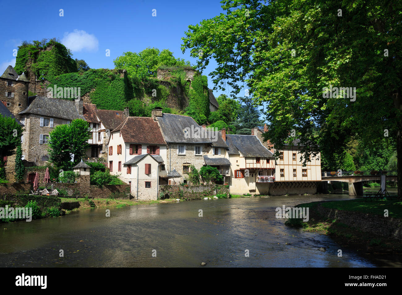 The medieval village of Segur-le-Chateau with half-timbered houses and a castle along Auvezere river in the Dordogne in France. Stock Photo