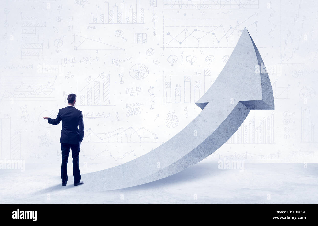 Financial businessman with arrow concept Stock Photo - Alamy