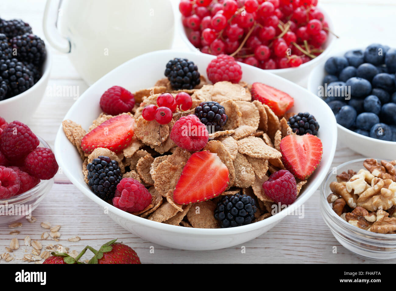 Breakfast berries, fruit and muesli on white wooden Stock Photo Alamy