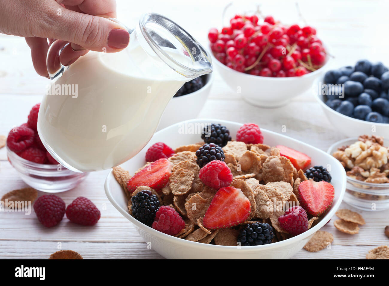 Breakfast berries, fruit and muesli on white wooden Stock Photo Alamy