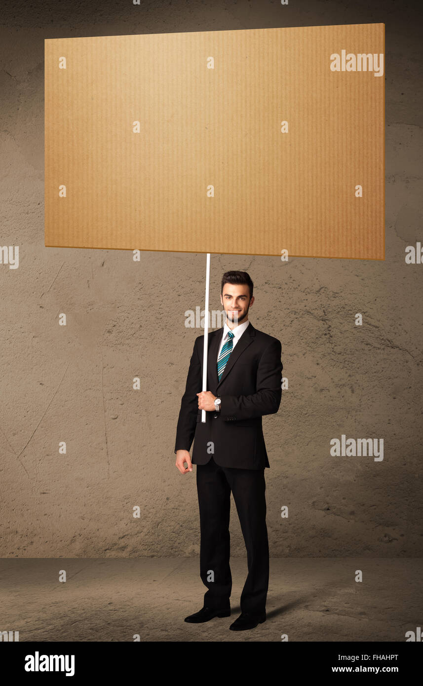 Businessman with blank cardboard Stock Photo