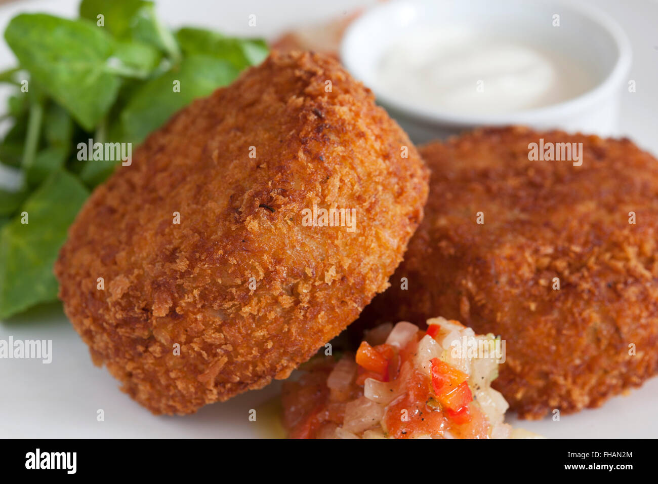 Fish cakes with salsa and mayo Stock Photo Alamy