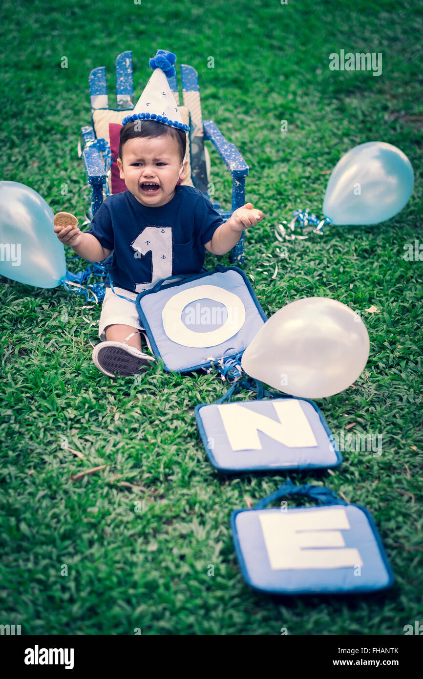 Celebrating baby boy's first birthday Stock Photo Alamy