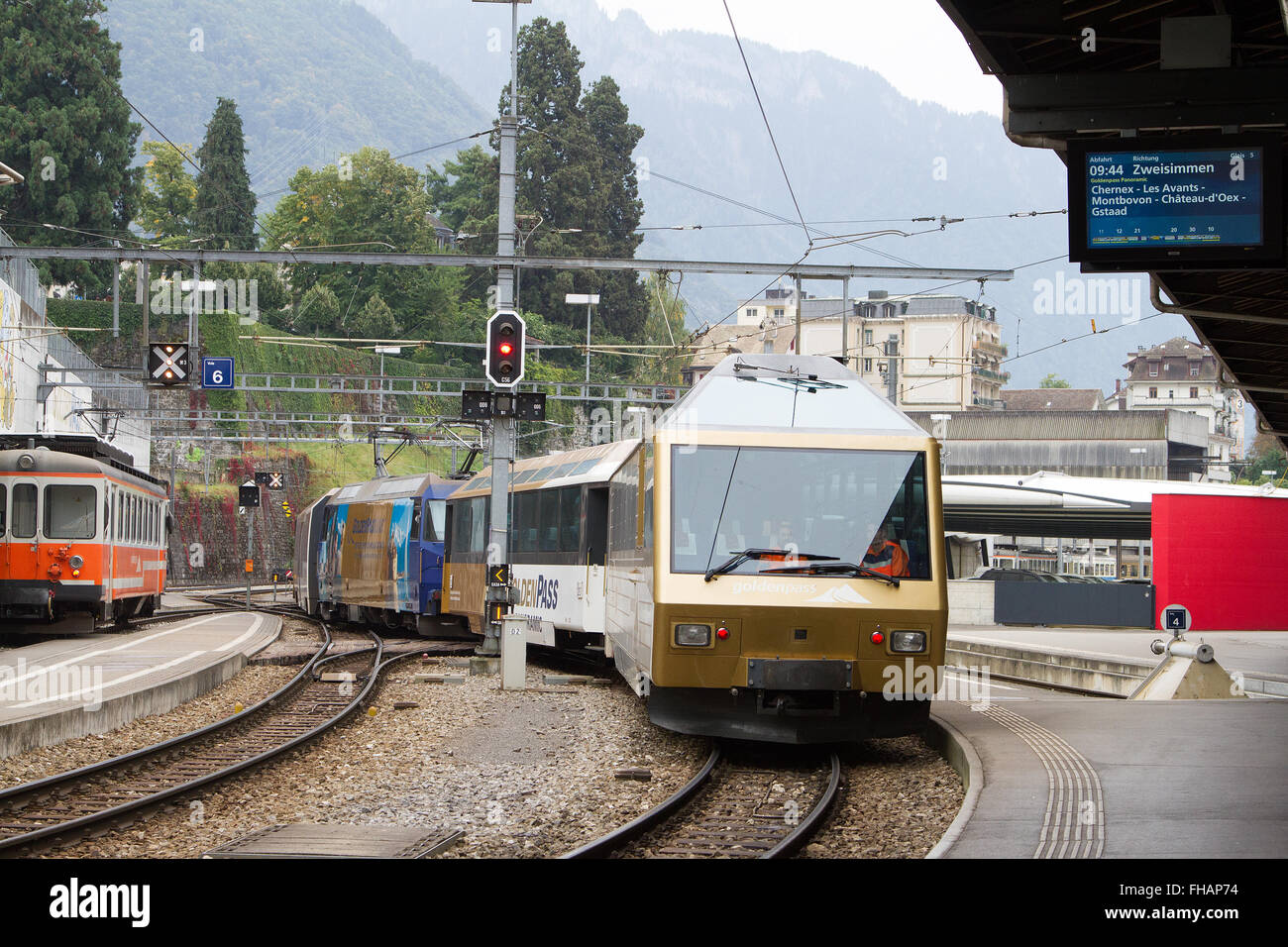 Golden Pass train entering Montreux station heading for Interlaken Stock Photo