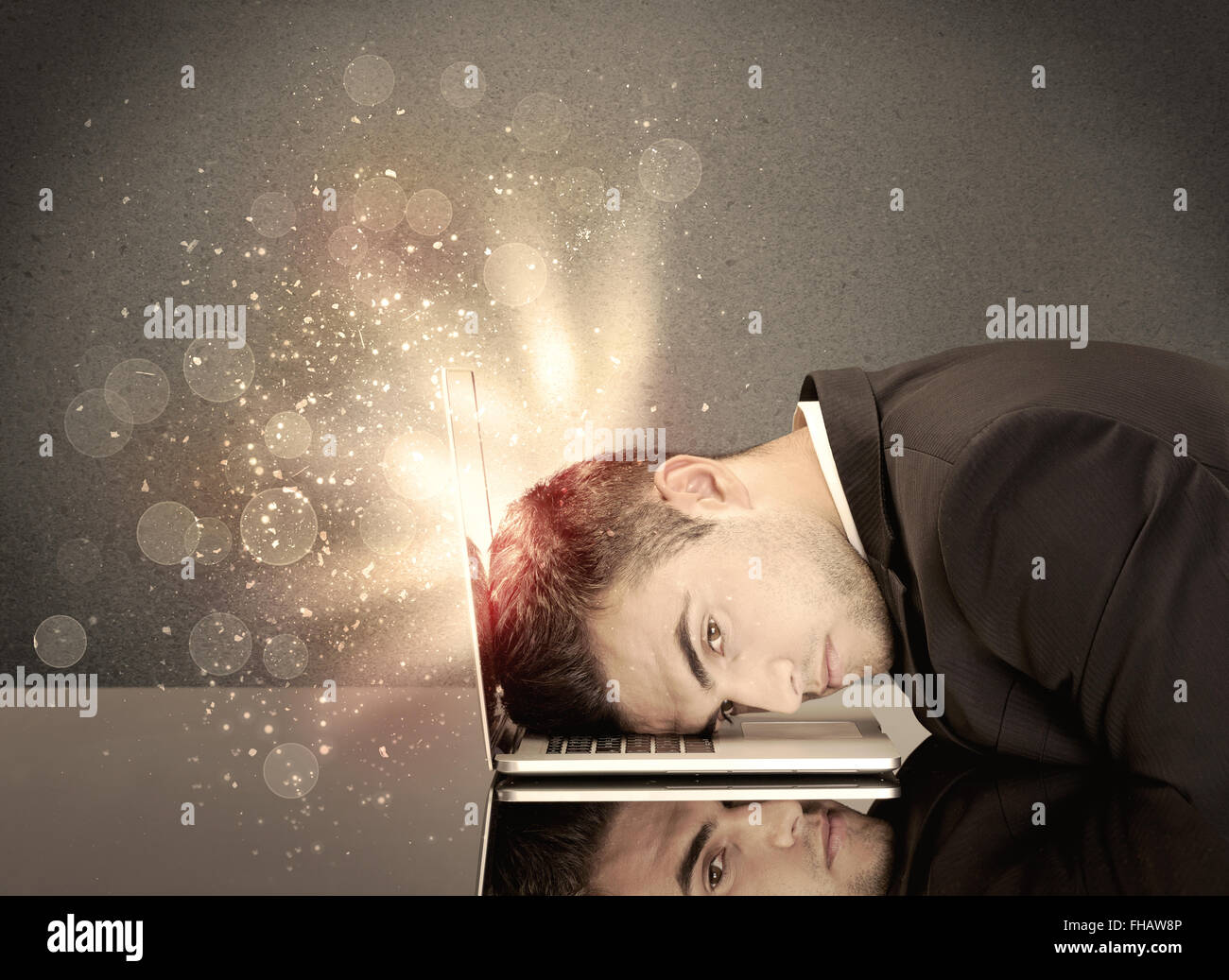 Angry businessman with lights and keyboard Stock Photo