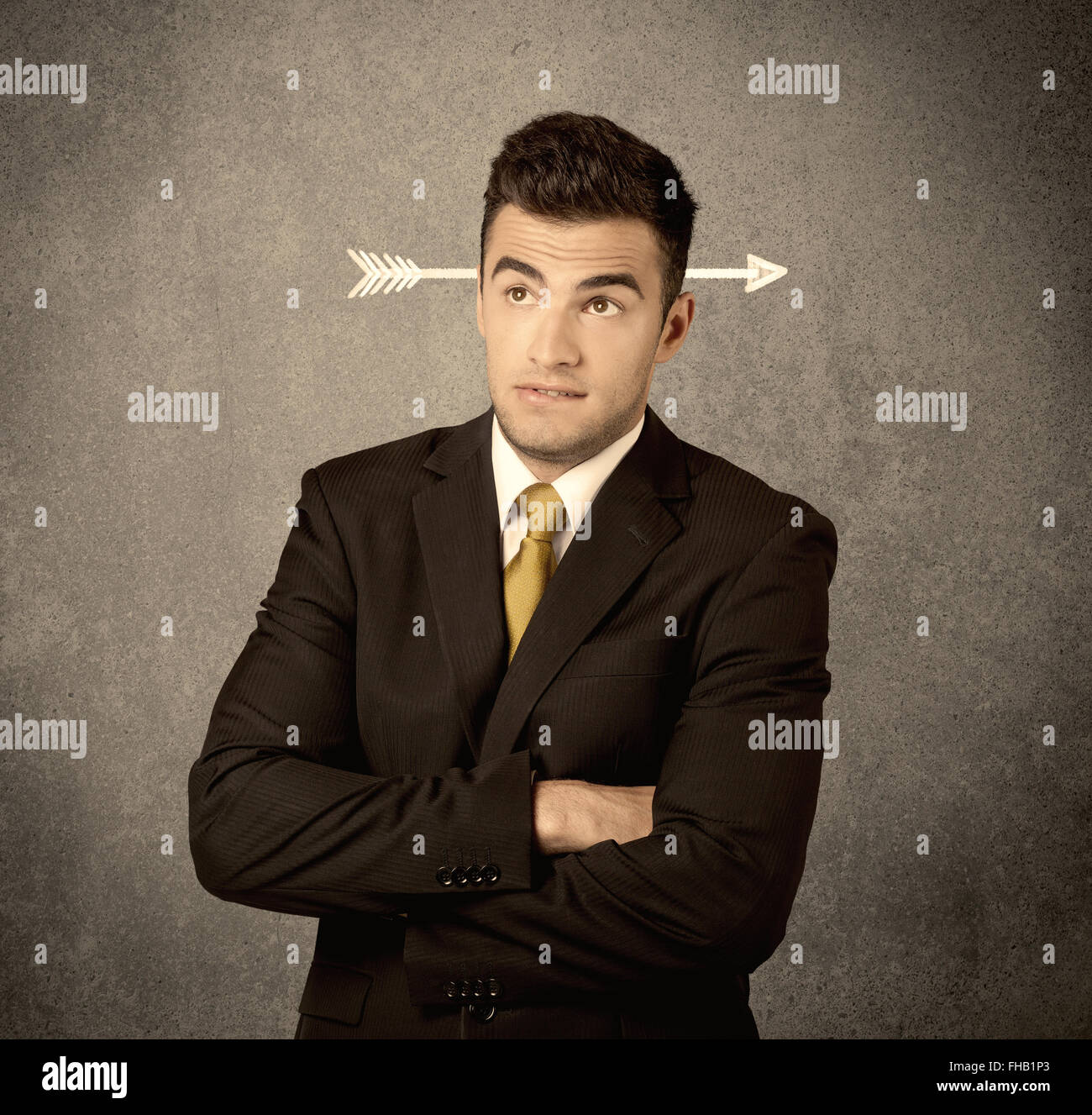 Young sales guy with arrow in the head Stock Photo - Alamy