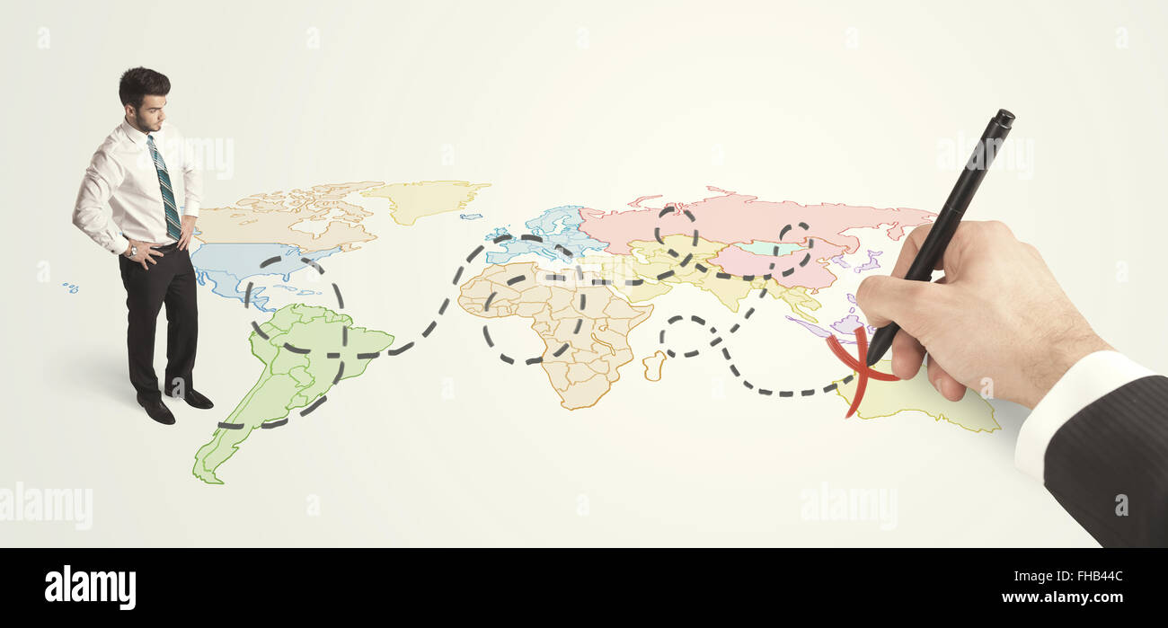 Businessman looking at map and route drawn by hand Stock Photo