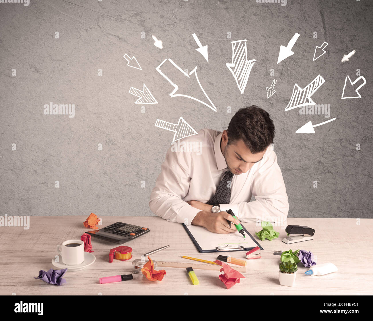 Busy office worker with drawn arrows Stock Photo - Alamy