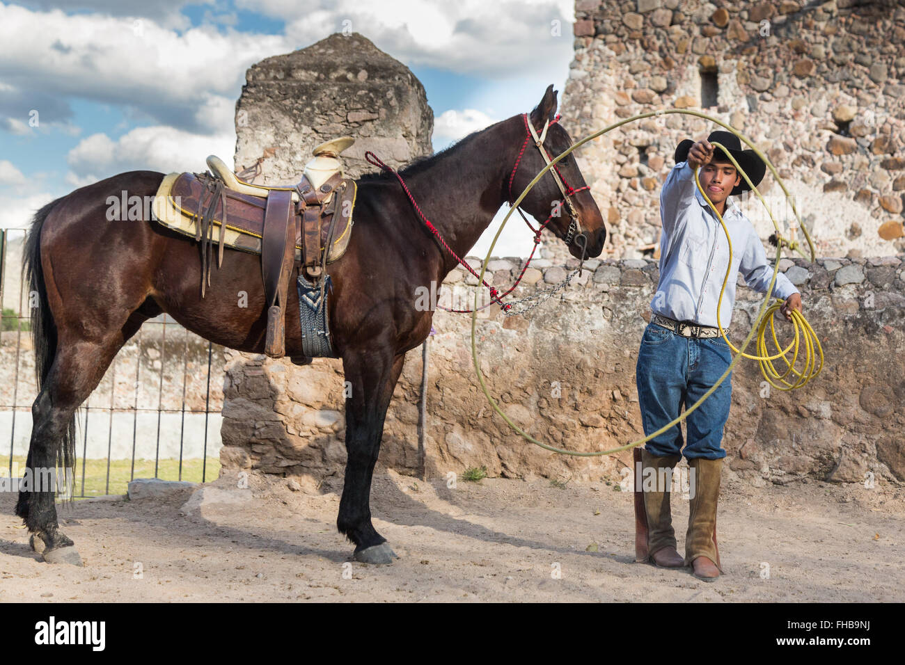 A Mexican Charro Or Cowboy Practices Roping Skills With His Horse At Stock Photo Alamy