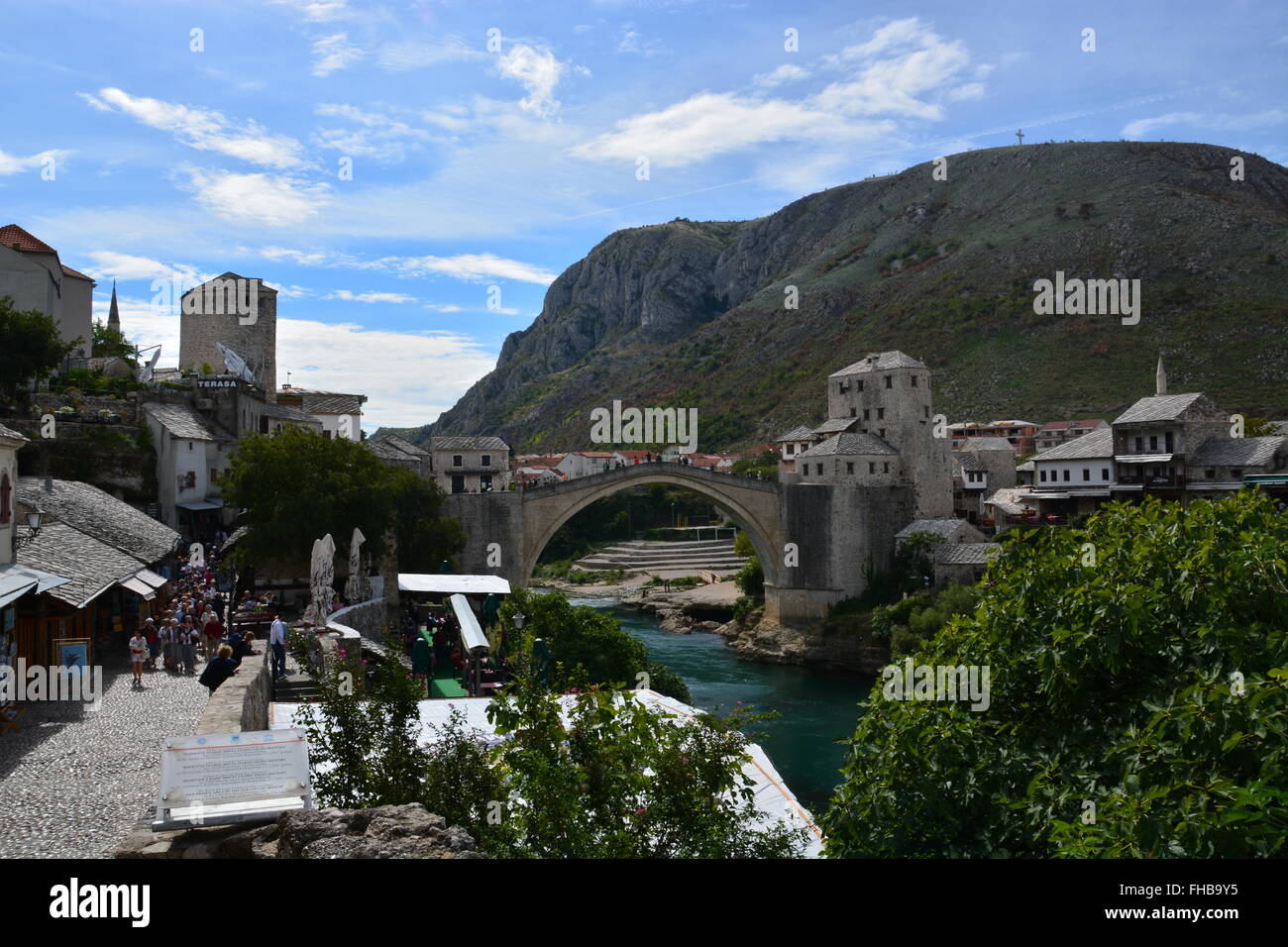 The tourist markets near the rebuilt 16th Century Ottoman bridge Stari Most or old bridge in Mostar. Stock Photo