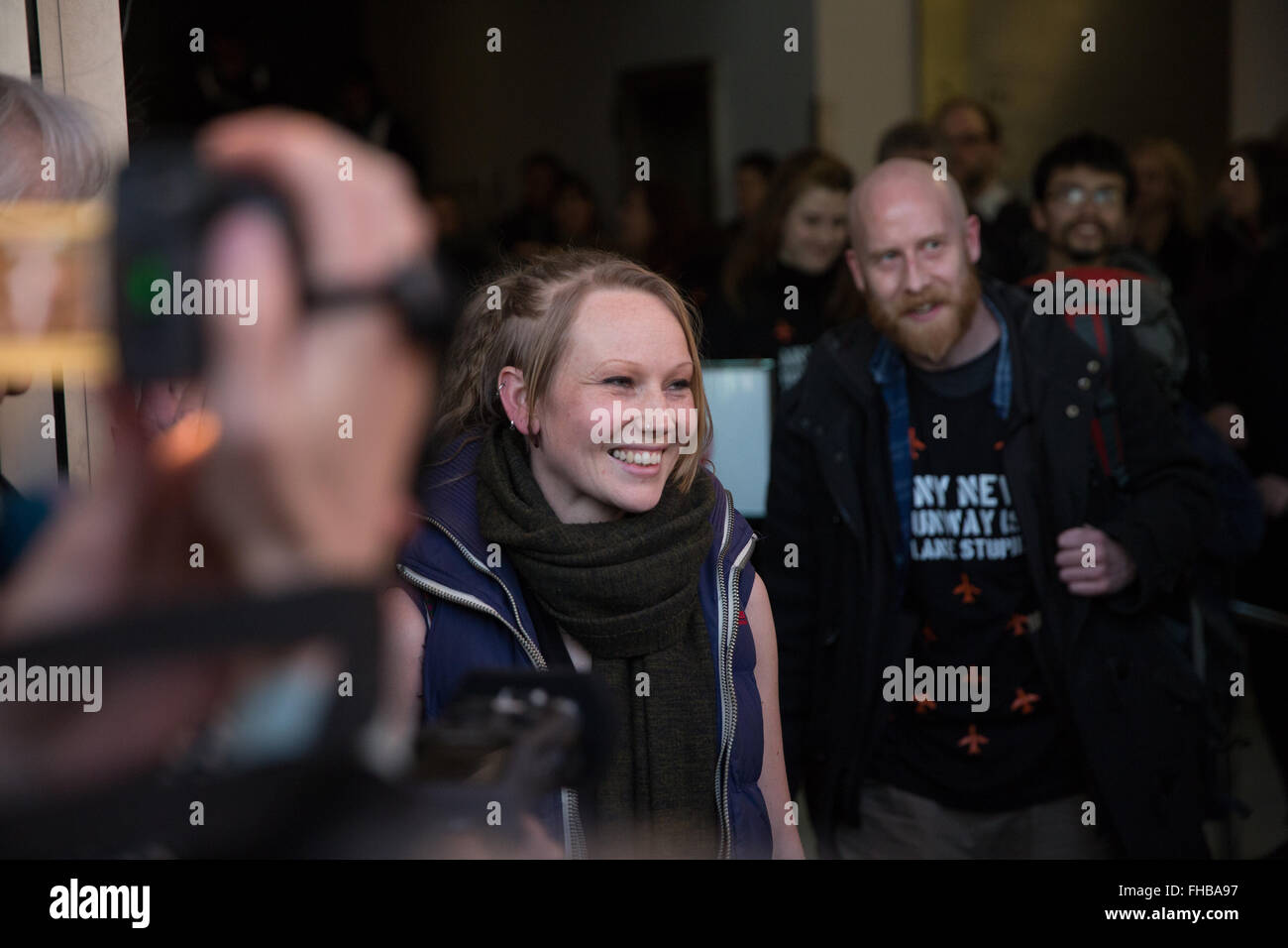 London, UK. 24th February, 2016. Kara Moses and Graham Thompson lead members of the Heathrow 13 out of Willesden Magistrates Court after avoiding custodial sentences. Credit:  Mark Kerrison/Alamy Live News Stock Photo