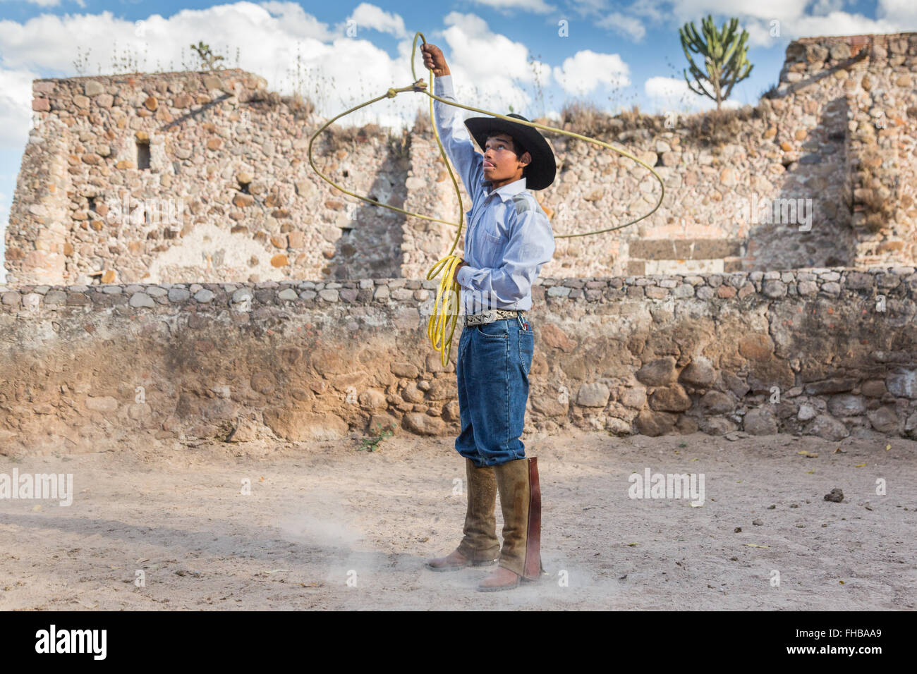 Charro Rodeo Ropes A Mexican charro or cowboy practices roping skills at a hacienda ranch ...