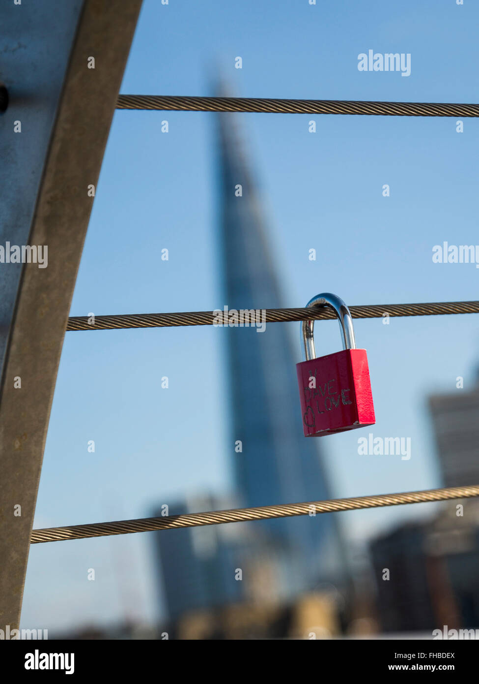 Love padlocks attached to the Millennium Bridge symbolising love with
