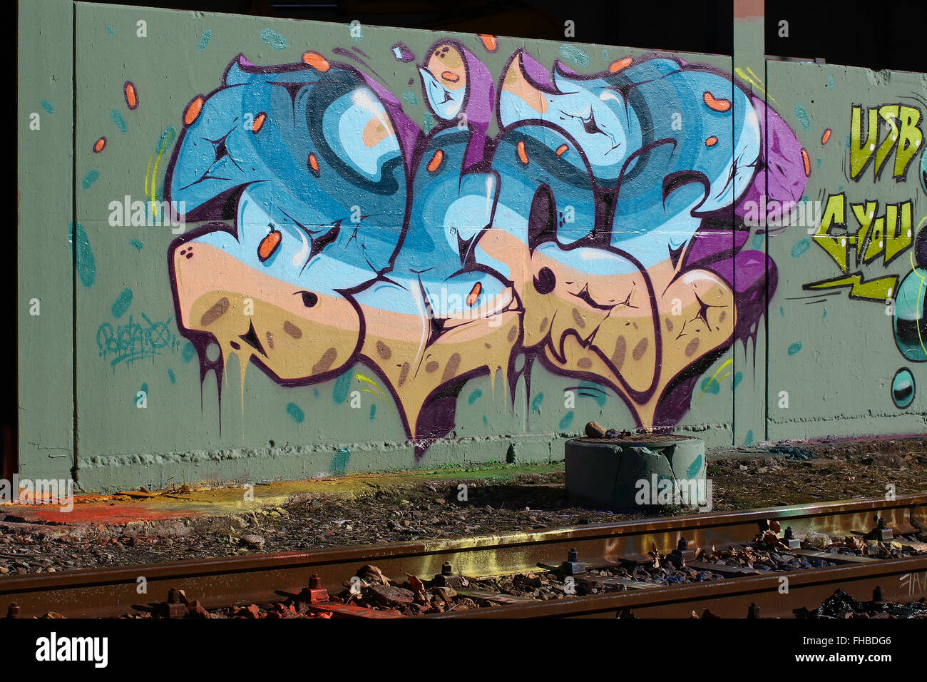 Cadenazzo, Switzerland, February 2016:Urban wall graffiti art along railroad tracks keep popping up Stock Photo