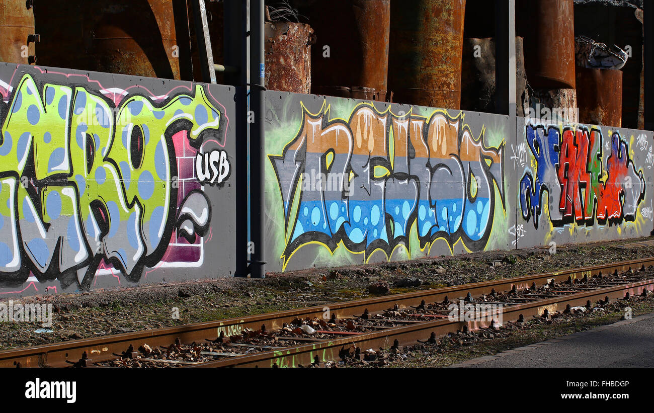Cadenazzo, Switzerland, February 2016:Urban wall graffiti art along  railroad tracks keep popping up Stock Photo - Alamy