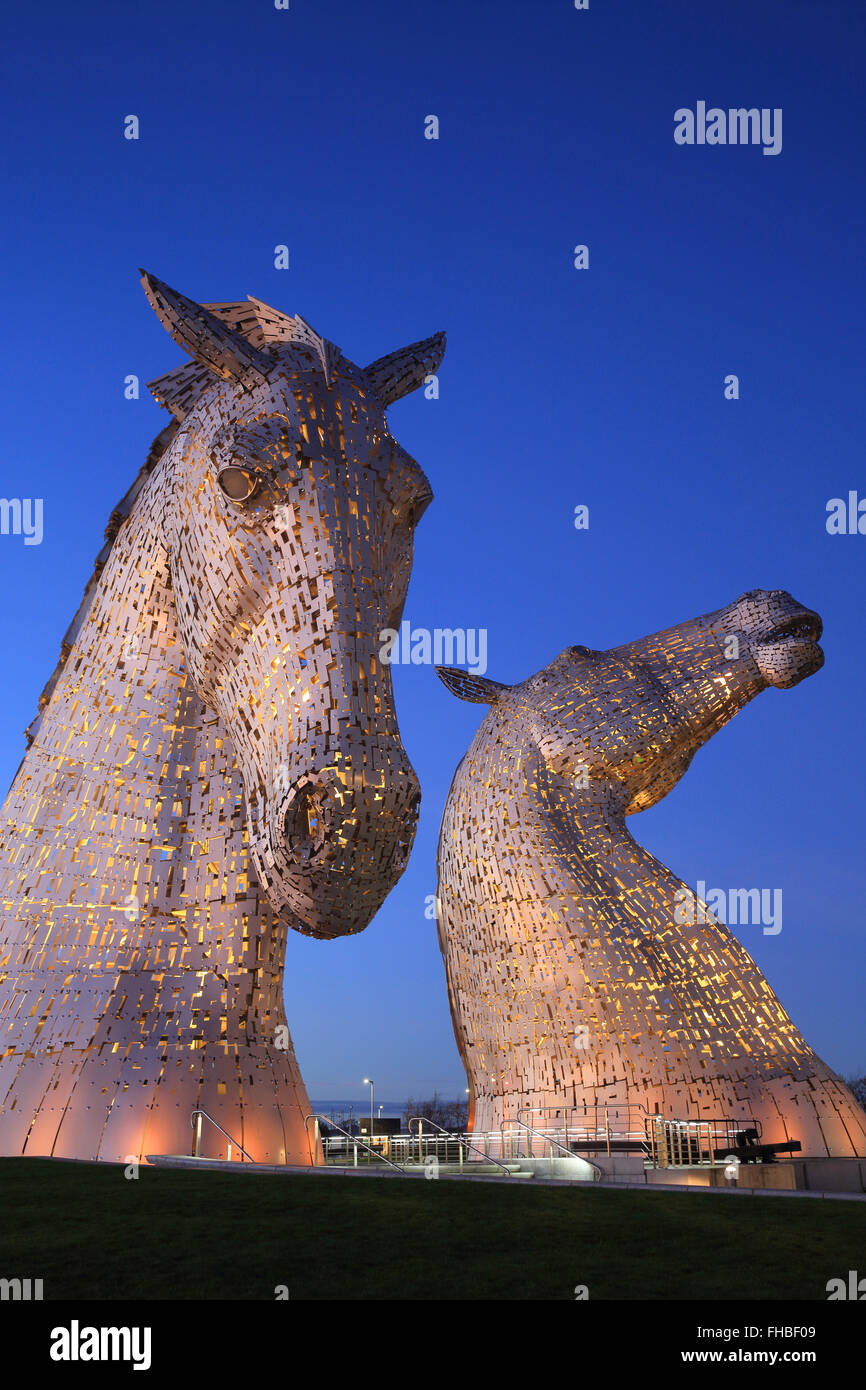 The Kelpies, the world's largest horse sculptures, illuminated at dusk
