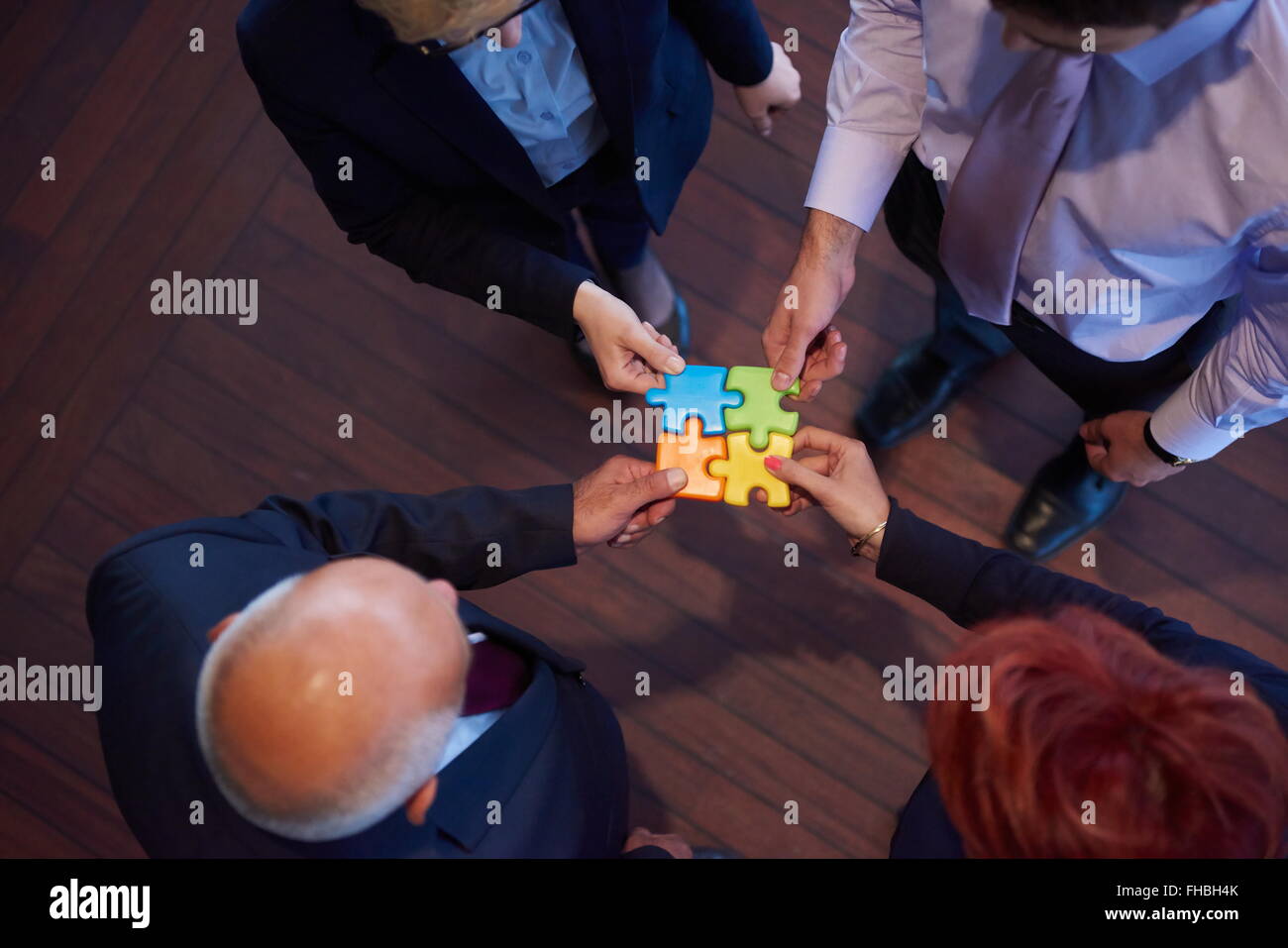 assembling jigsaw puzzle Stock Photo Alamy