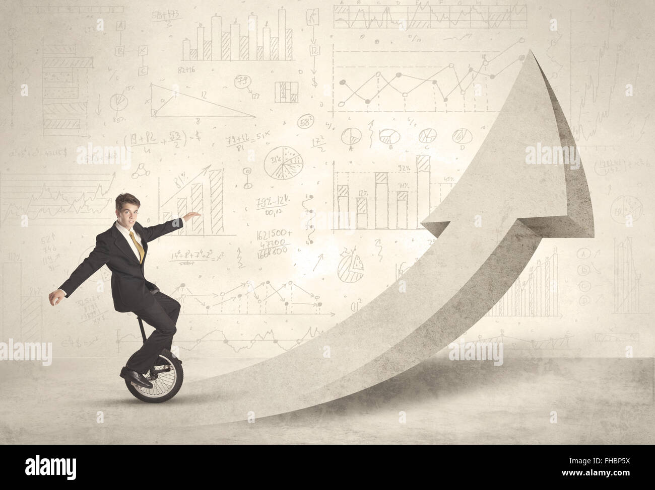 Happy business man riding a monocycle up on an arrow Stock Photo