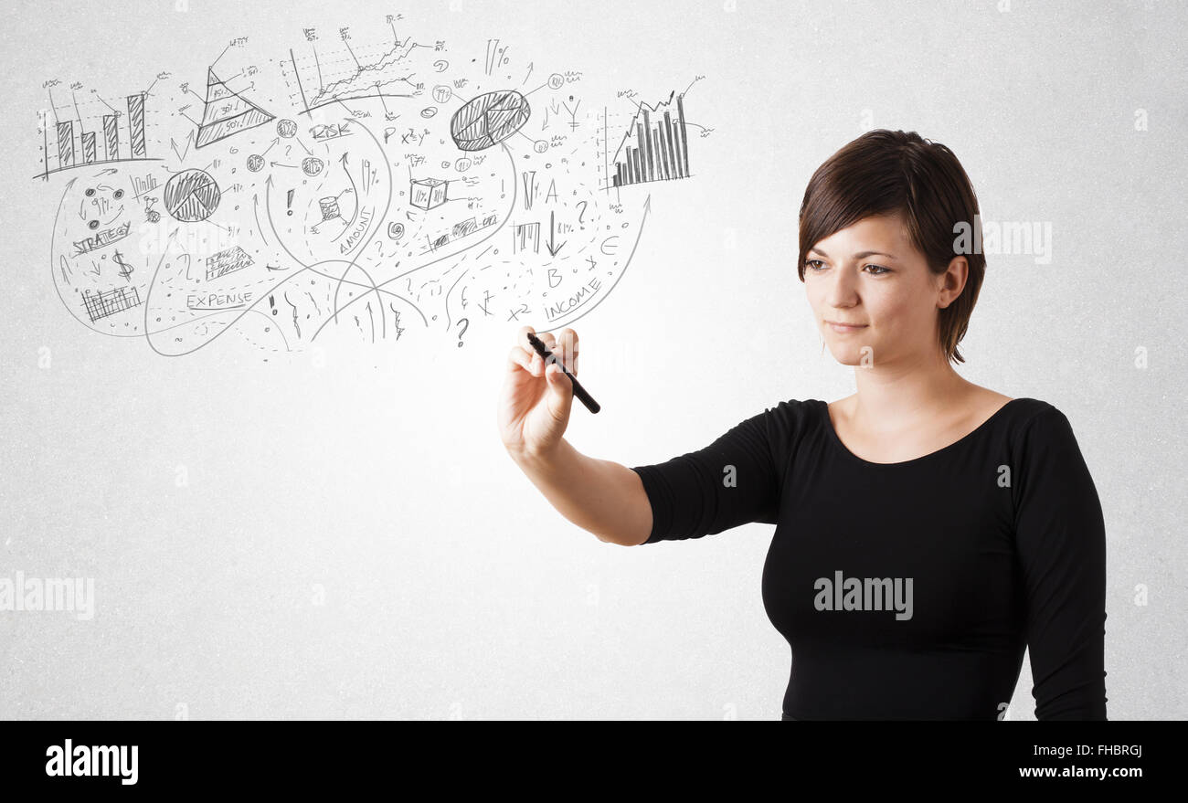 Pretty girl sketching graphs and diagrams on wall Stock Photo - Alamy