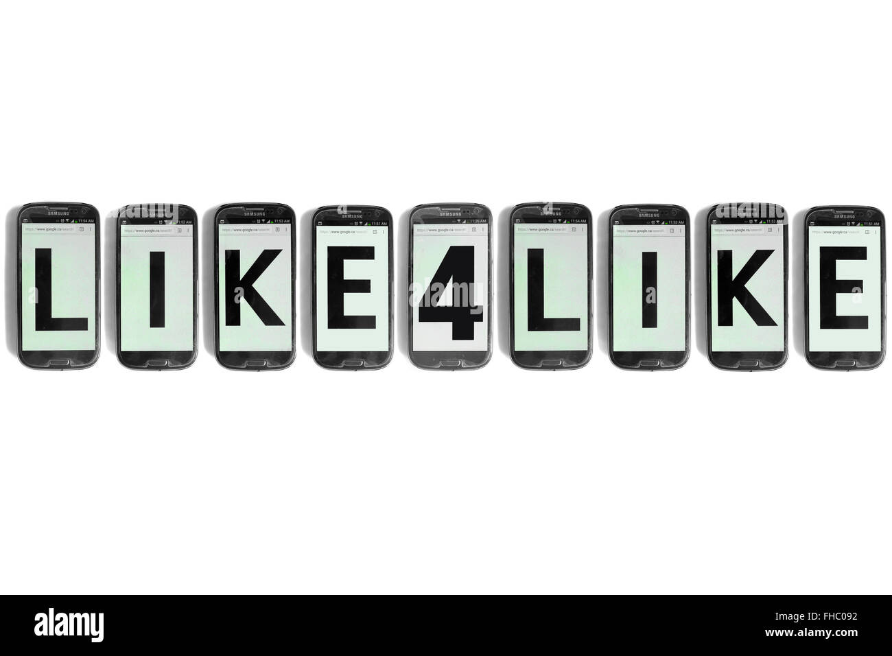 Like4Like written on the screens of smartphones photographed against a white background. Stock Photo