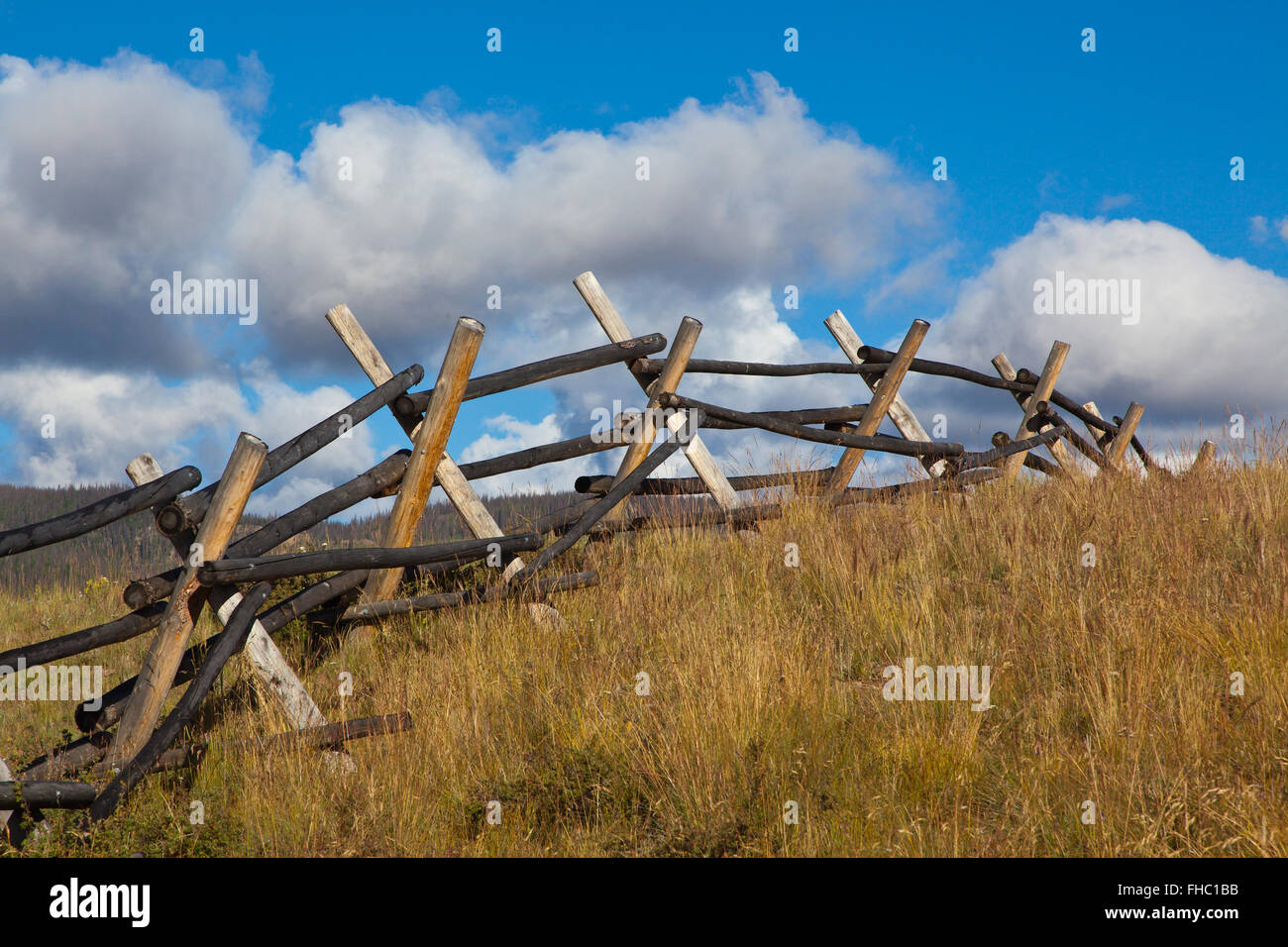 A snow fence near North Creek Gorge in the SAN JUAN MOUNTAINS of SOUTHERN COLORADO Stock Photo