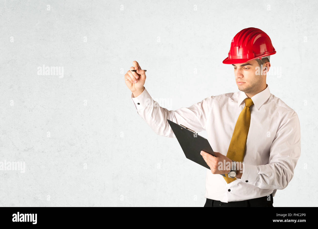Young architect drawing in empty space Stock Photo - Alamy