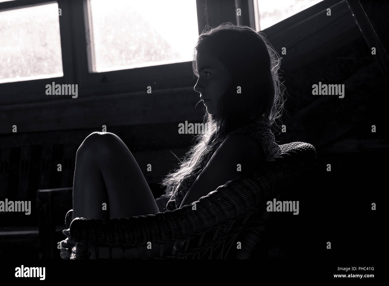 bw shot of a profile silhouette of a teenage girl Stock Photo
