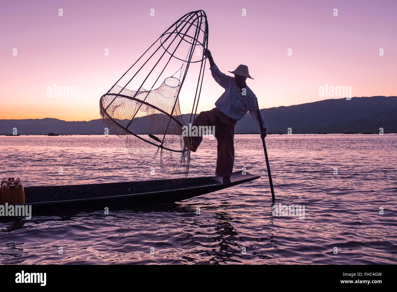Silhouette of fisherman at sunset Inle Lake Burma Myanmar Stock Photo ...