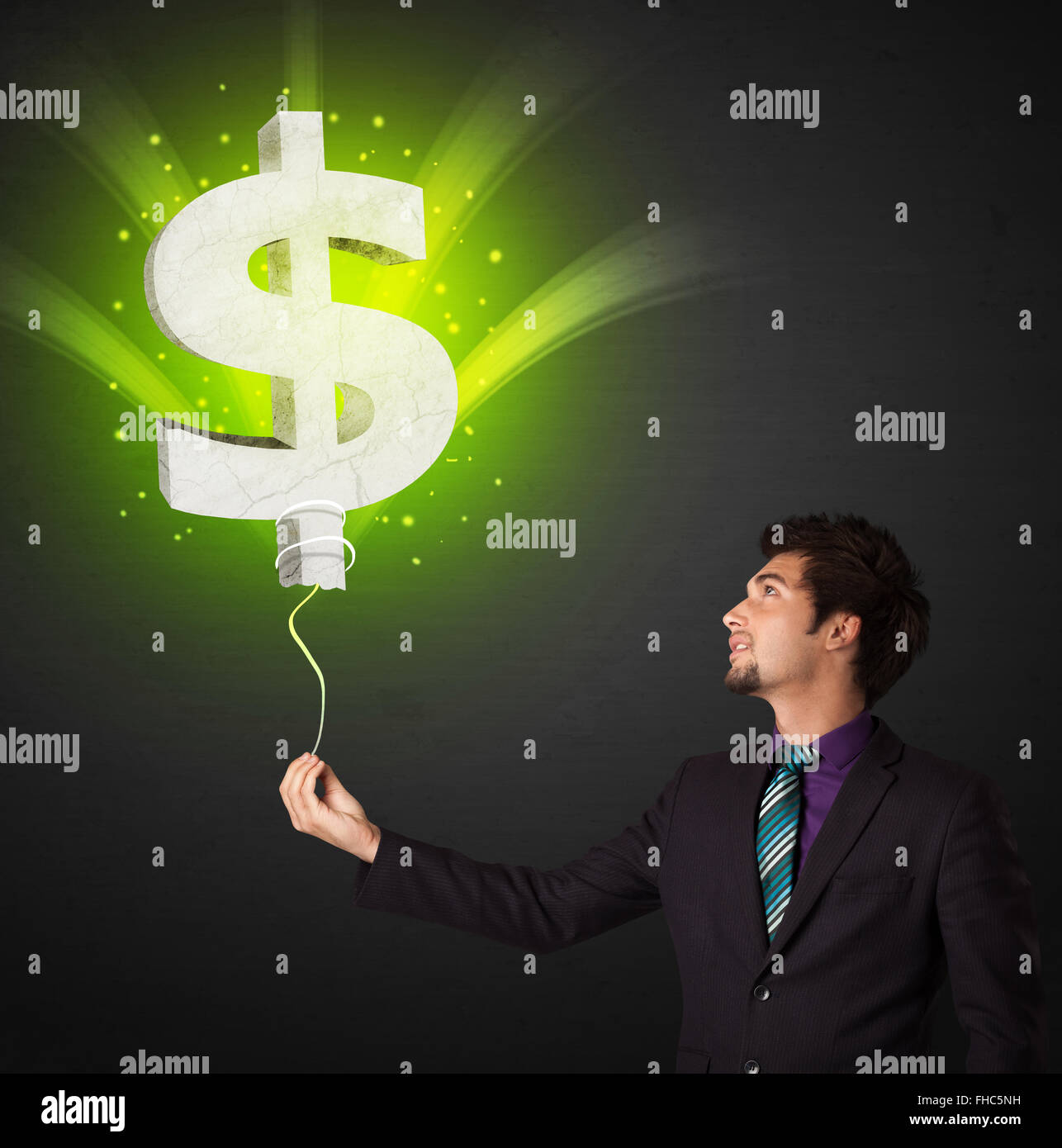 Businessman with a dollar sign balloon Stock Photo - Alamy