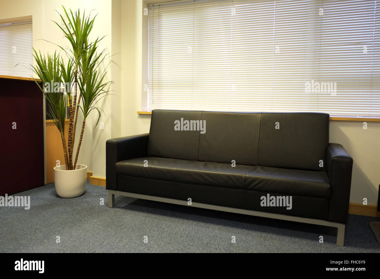 Couch, a reception area sofa new and still empty, maybe an office or Dr