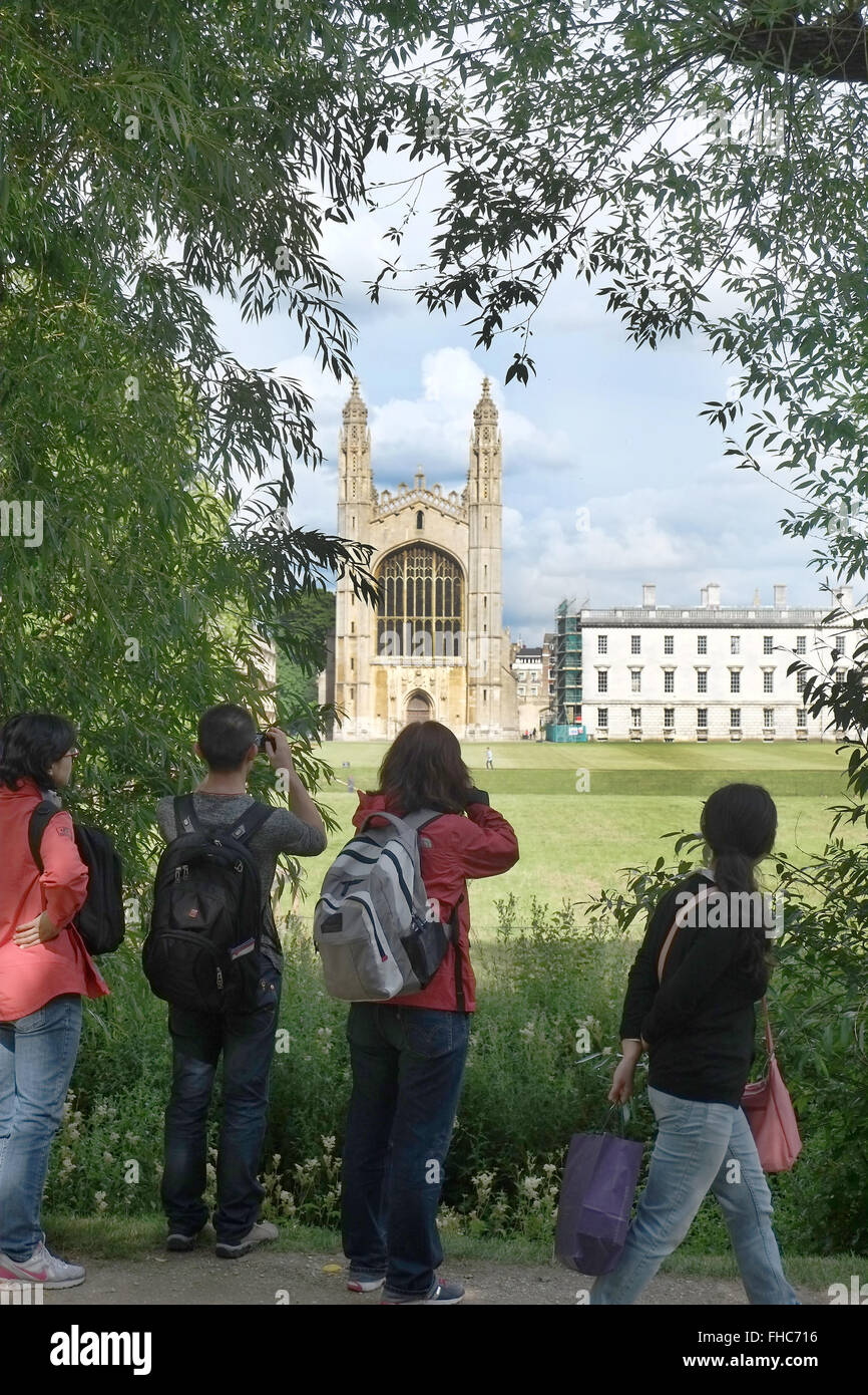 Tourists taking pictures of the famous view of the chapel at King's college  at Cambridge University. 6th July 2014 Stock Photo