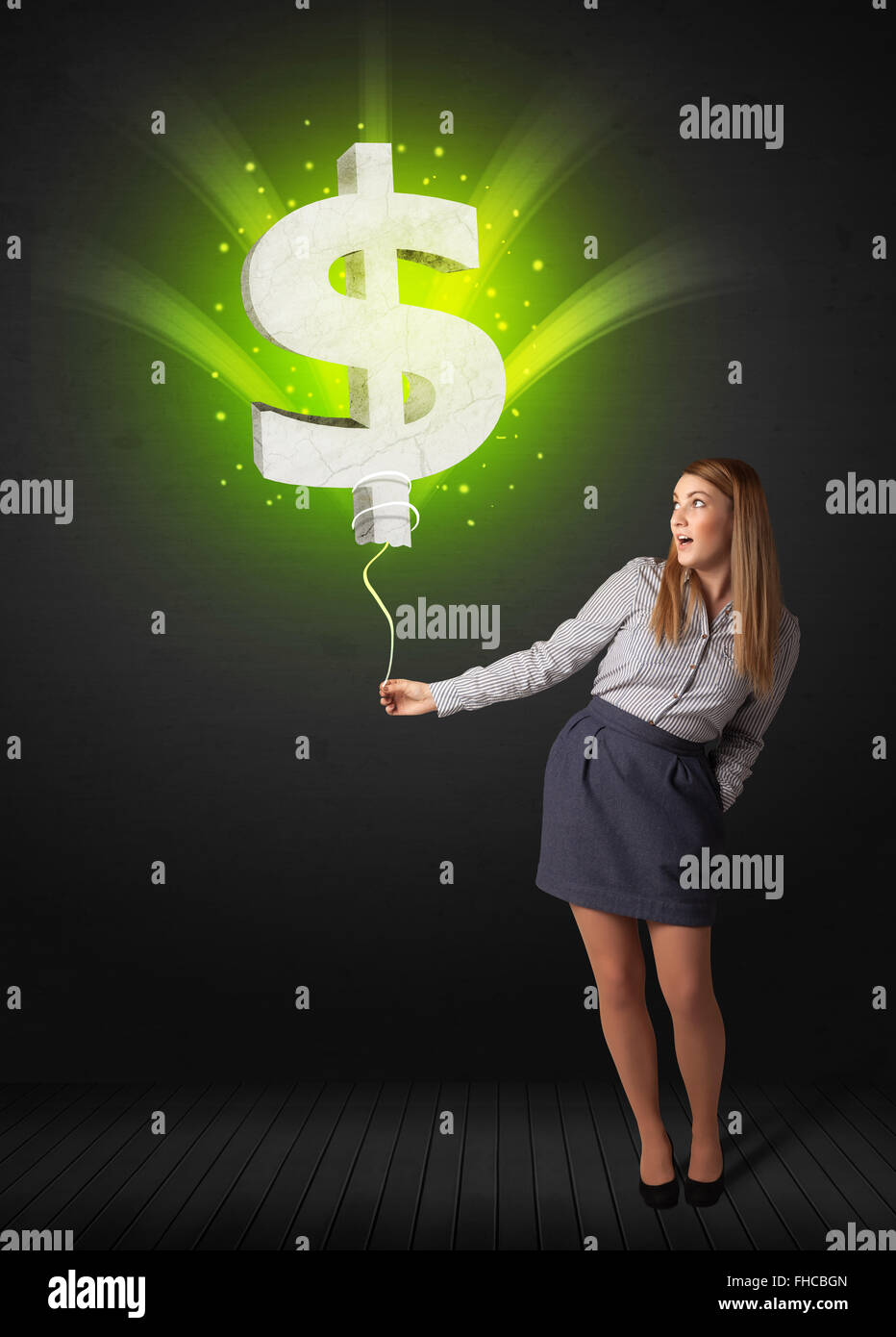 Businesswoman with a dollar sign balloon Stock Photo - Alamy