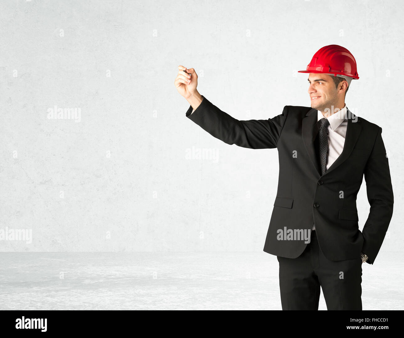 Young architect drawing in empty space Stock Photo - Alamy