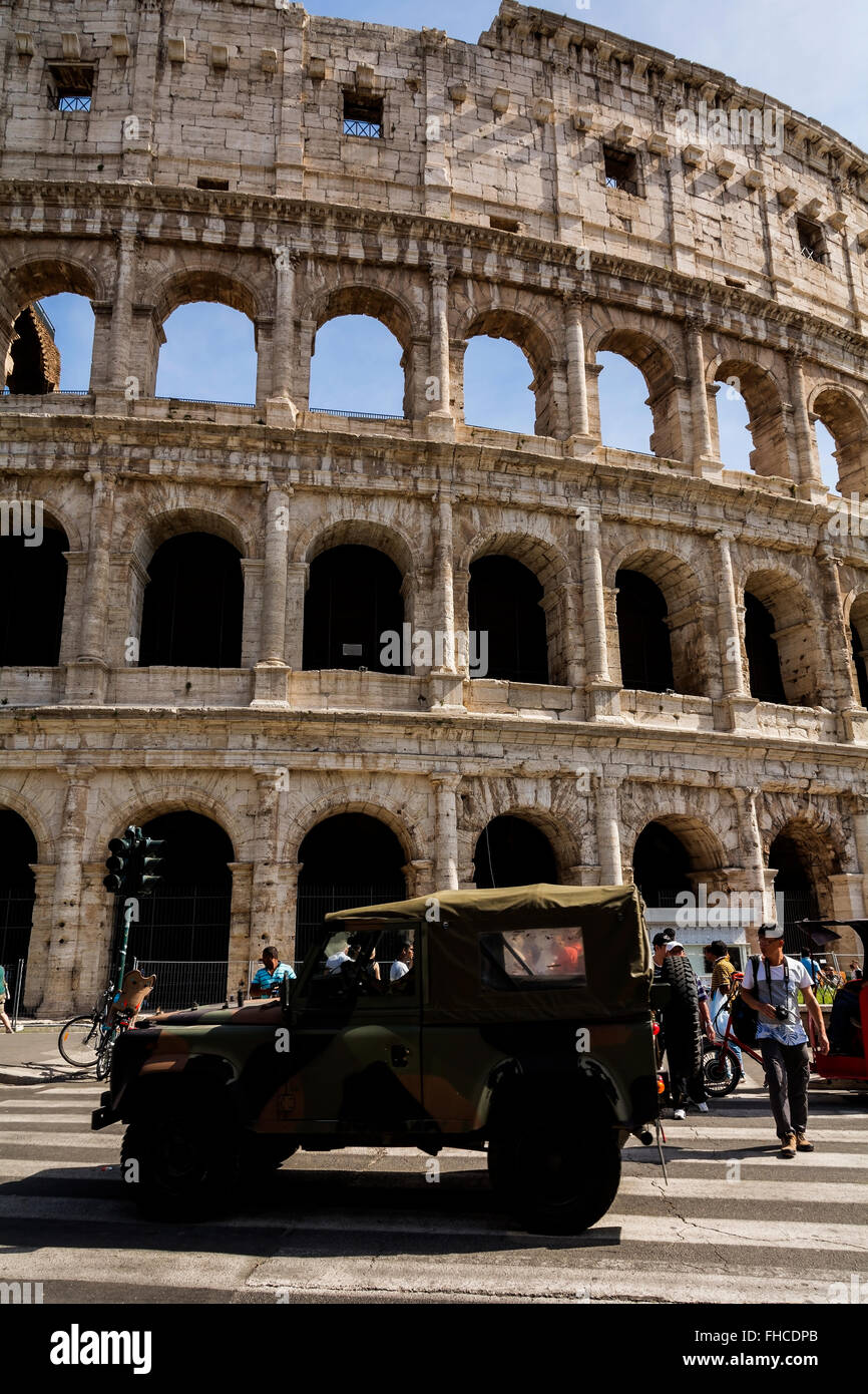 An Italian army jeep patrolling the road outside of the Colosseum in Rome, Italy. Stock Photo