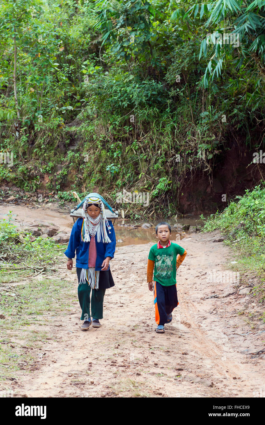 Akha woman and child walking to the village, Burma. Stock Photo