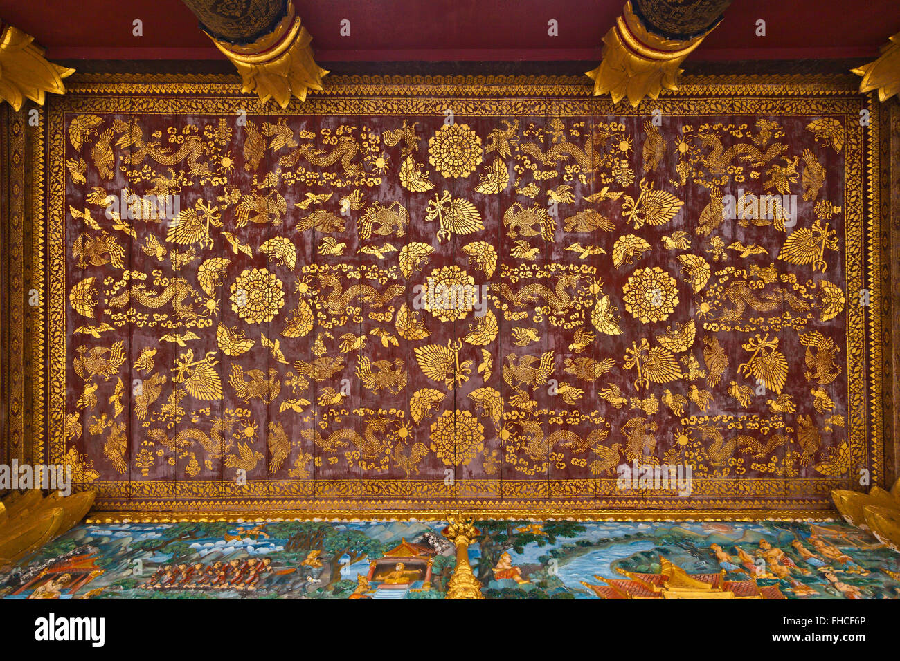 Stenciled DRAGON & PHOENIX ceiling designs on a BUDDHIST TEMPLE  - LUANG PRABANG, LAOS Stock Photo