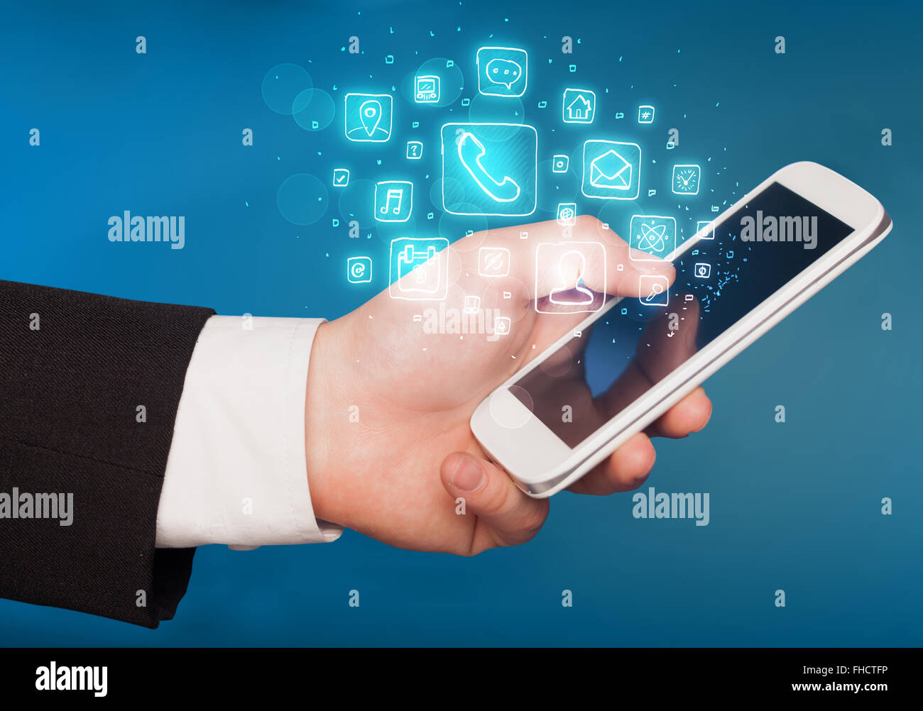 Hand holding smartphone with mobile app icons Stock Photo - Alamy