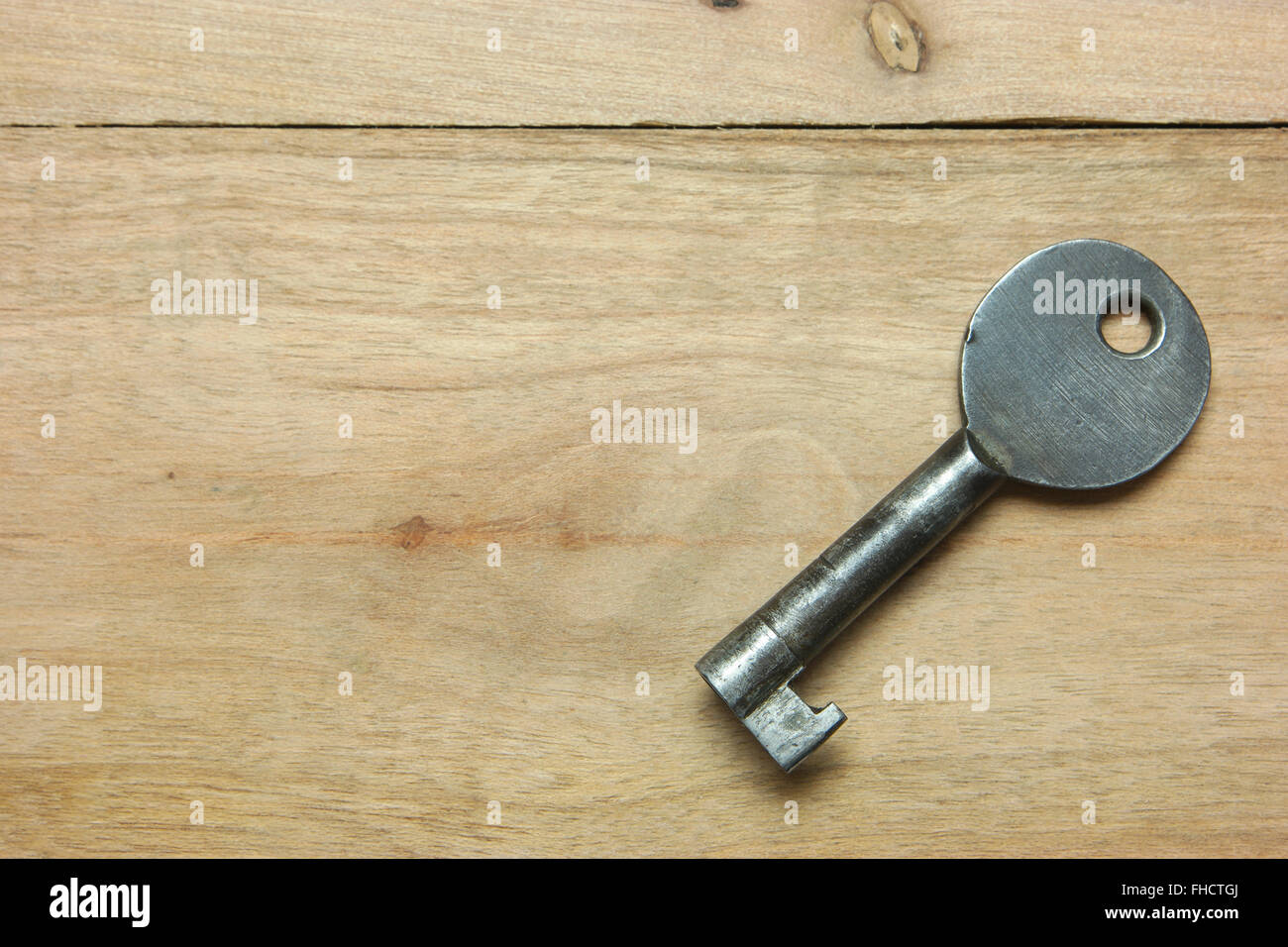 Old key On wooden retro Stock Photo