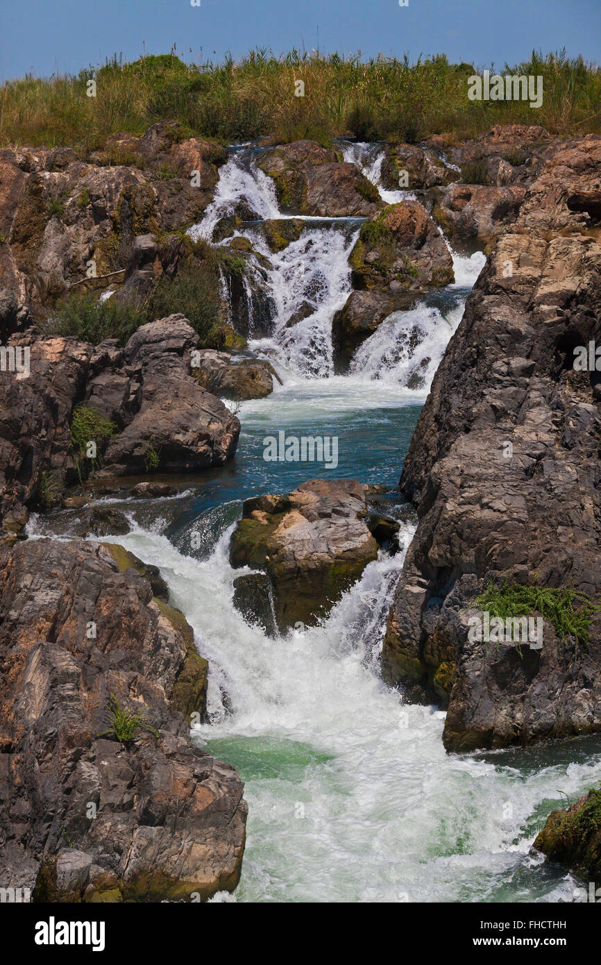 The TAM I DAENG WATERFALL is off the beaten track on the MEKONG RIVER in the 4 Thousand Islands Area (Si Phan Don) near DONE KHO Stock Photo