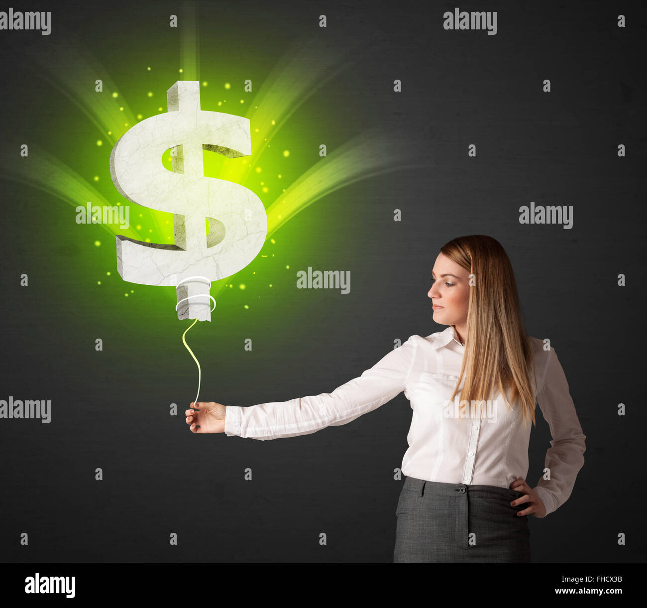 Businesswoman with a dollar sign balloon Stock Photo - Alamy